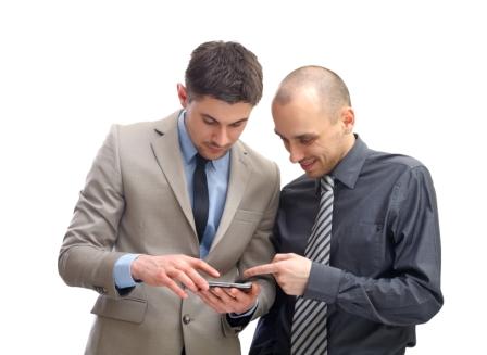 Two Men Viewing Small Device